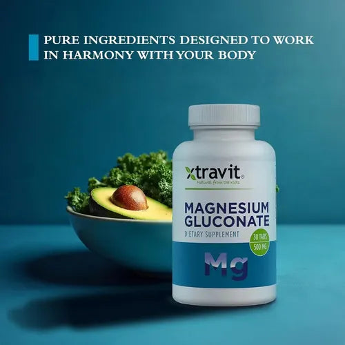 Frasco de Magnesium Gluconate Xtravit junto a un aguacate y col rizada