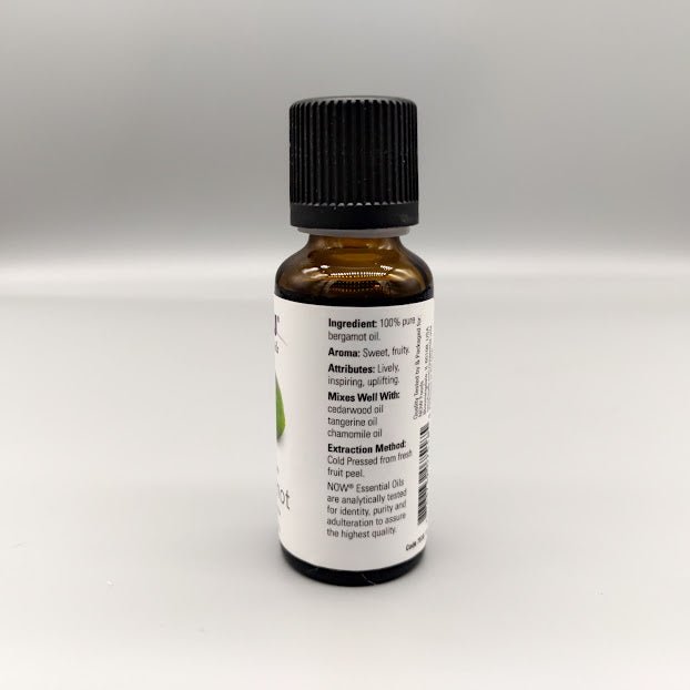 Side of the NOW bergamot bottle: ingredient, aroma, attributes, blends and cold pressed peel extraction