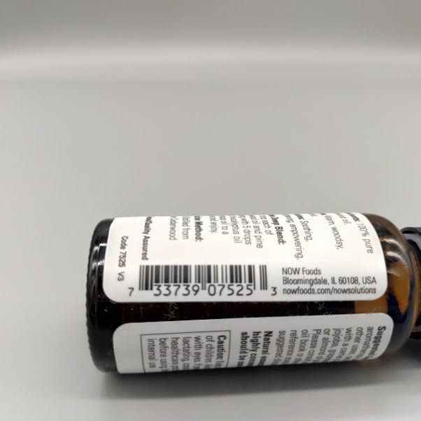 Bottom of the NOW cedarwood bottle: barcode 7 33739 07525 3 and NOW Foods, Bloomingdale, IL