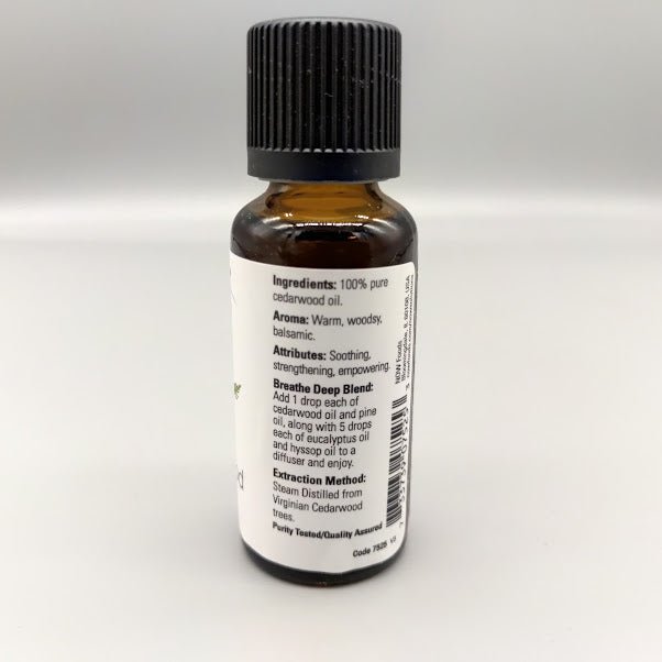 Side of the NOW cedarwood bottle: ingredients, aroma, attributes, Breathe Deep Blend and extraction method