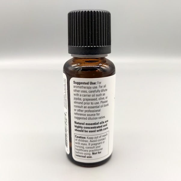 Back of the NOW cedarwood bottle: suggested use, carrier oil dilution and caution