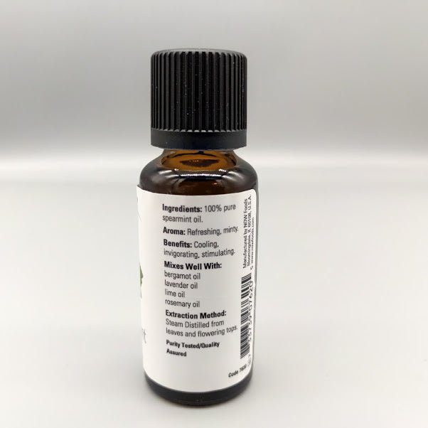 Side of the NOW spearmint bottle: ingredients, aroma, benefits, mixes well with and extraction method