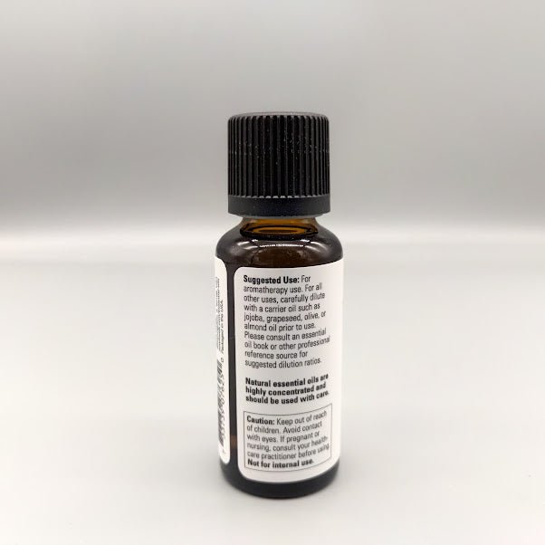 Side of the NOW tea tree bottle: suggested use, carrier oil dilution and caution