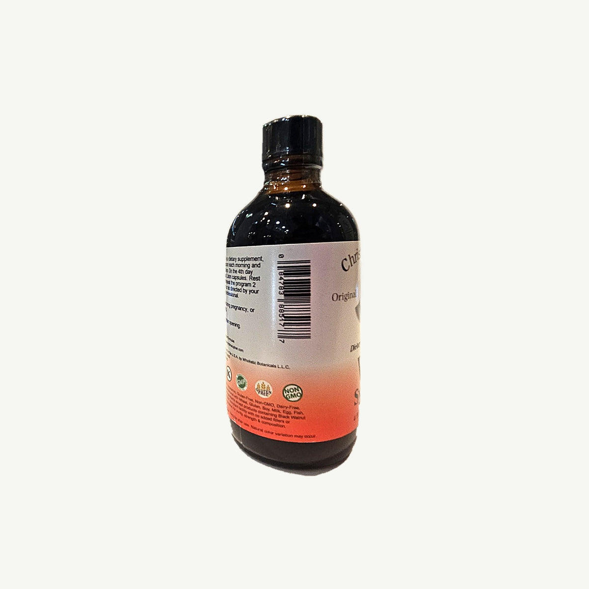 Foto real del lado de VF Syrup con el código de barras 0 84783 88517 7 y el final de las declaraciones