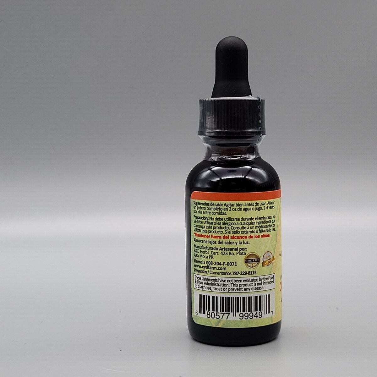 Costado del frasco de caléndula E&D Herbs: sugerencias de uso, precaución, fabricante en Moca, PR, y aviso de la FDA